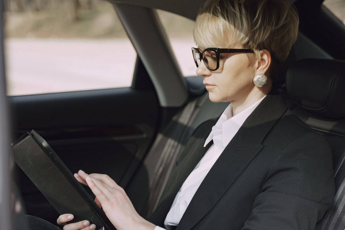 Business woman in private car